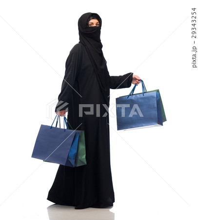 muslim woman in hijab with shopping bags muslim woman in hijab with shopping bags 29343254