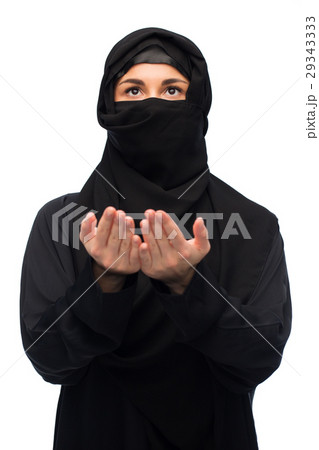 praying muslim woman in hijab over white praying muslim woman in hijab over white 29343333