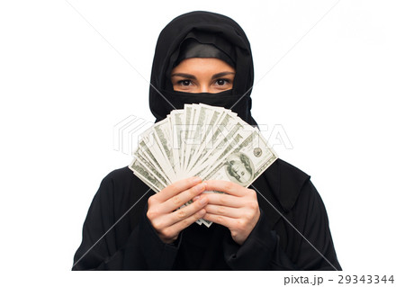 muslim woman in hijab with money over white 29343344
