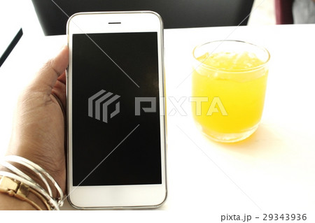 Orange juice with smart phone 29343936