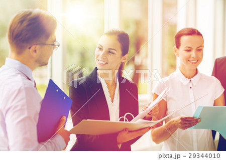business team with folders meeting at office business team with folders meeting at office 29344010