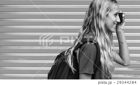 Woman taking a photo wall background 29344284