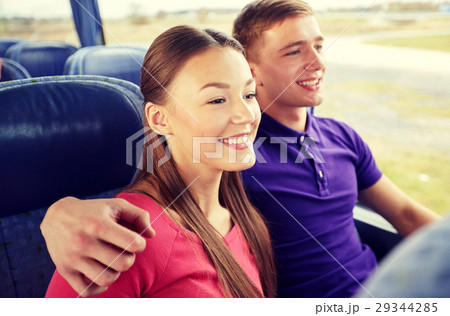 happy teenage couple or passengers in travel bus happy teenage couple or passengers in travel bus 29344285