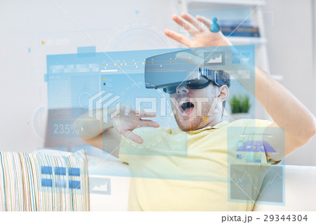 young man in virtual reality headset or 3d glasses 29344304