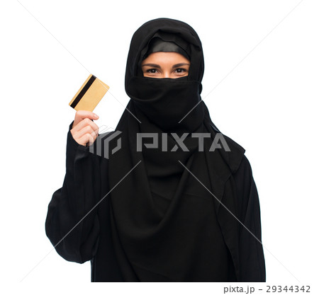 muslim woman in hijab with credit card over white muslim woman in hijab with credit card over white 29344342