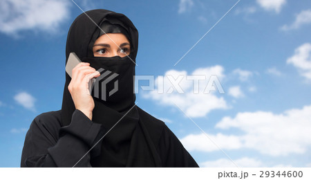 muslim woman in hijab over white background 29344600