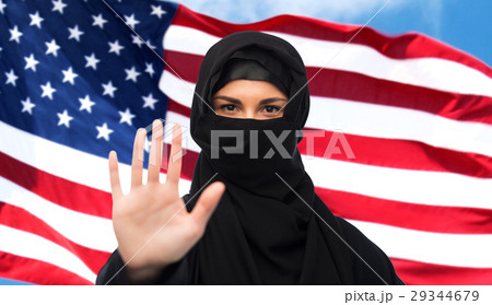 muslim woman in hijab showing stop sign 29344679
