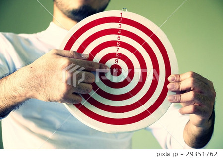 Man is pointing at dart, goal setting concept Man is pointing at dart, goal setting concept 29351762