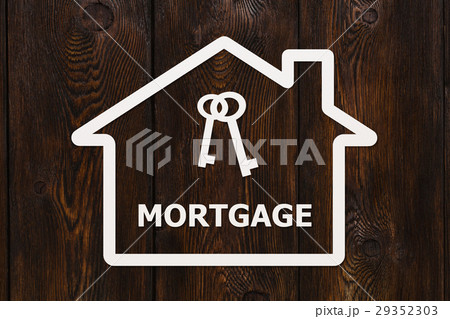 Paper house with keys and mortgage text inside Paper house with keys and mortgage text inside 29352303