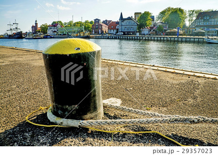 bollard in a seaport with sailing ship 29357023