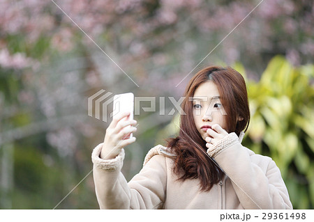 Asian woman selfie with cherry blossom sakura 29361498