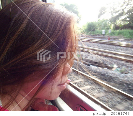 woman hair wind blow while traveling on the train woman hair wind blow while traveling on the train 29361742