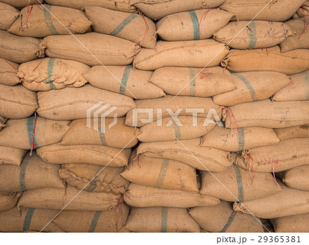Old hemp sacks stacked in a row. Old hemp sacks stacked in a row. 29365381