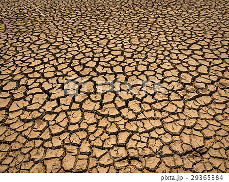 dried and cracked soil in arid season. dried and cracked soil in arid season. 29365384