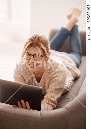 Joyful cute woman relaxing at home 29365403
