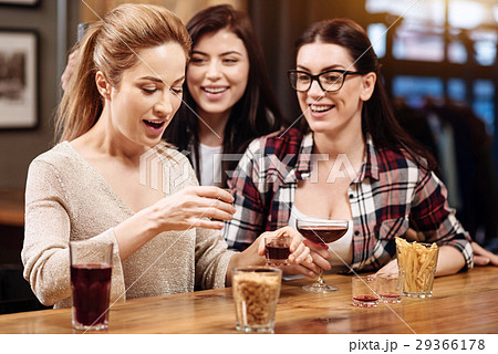 Positive delighted females cheering up their Positive delighted females cheering up their 29366178
