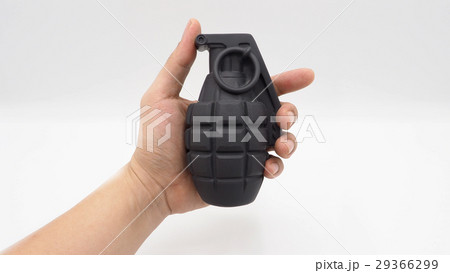 Man hand and military bomb plastic model toy. 29366299