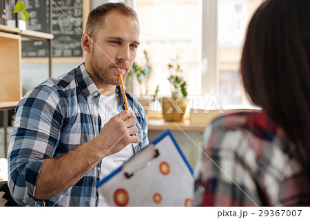 Pleasant nice man holding a pencil 29367007
