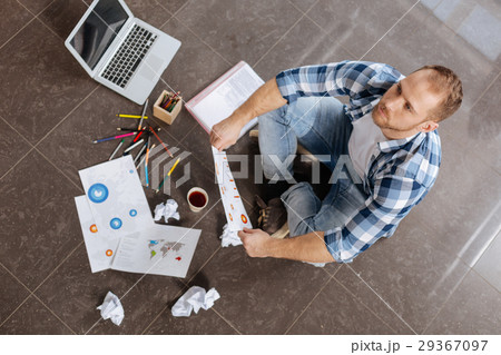 Thoughtful handsome man holding a drawing Thoughtful handsome man holding a drawing 29367097