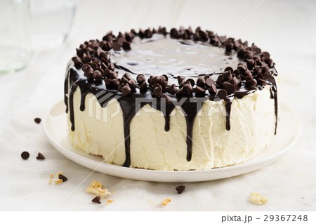 round cake with chocolate topping. 29367248