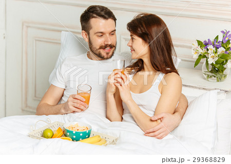 Relaxed Couple in Bed in bedroom at home 29368829