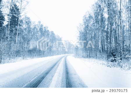 Snow-covered Open Road During A Snowstorm In 29370175
