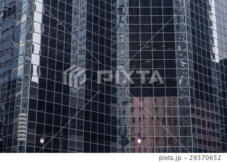 Imposing multi-storey buildings mirroring other Imposing multi-storey buildings mirroring other 29370652