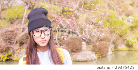 Japanese girl with glasses in a Plum blossom 29375425