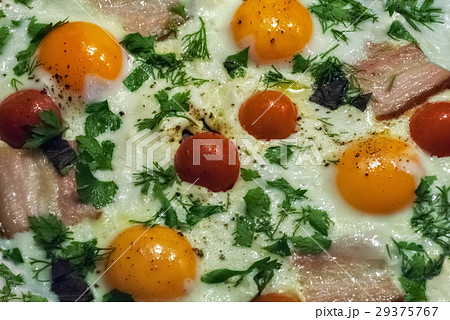 Scrambled eggs with bacon and tomatoes. Scrambled eggs with bacon and tomatoes. 29375767