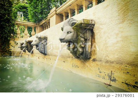 lion head fountain on wall with vintage filter 29376001