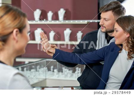 Beautiful couple at the jewelry store  29378449