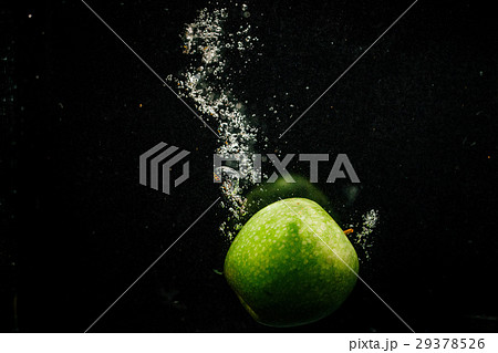 Green apple splashes water falling Green apple splashes water falling 29378526