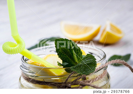 Rope twines around bottle with lemonade  29378766