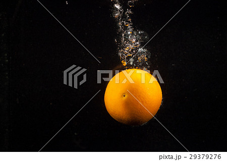 Bright heavy orange splashes water falling  Bright heavy orange splashes water falling  29379276