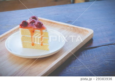 Sponge cake with cherry syrup in afternoon time 29383936