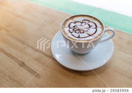 hot coffee with foam milk art in afternoon break 29383956