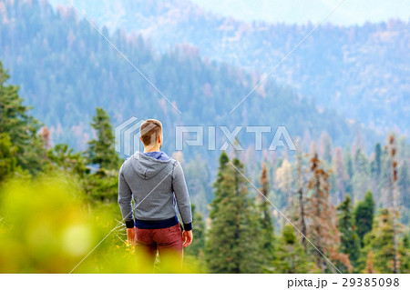 Tourist with backpack hiking in Sequoia National Park Tourist with backpack hiking in Sequoia National Park 29385098