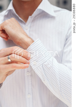Man buttons cuff-link on French cuffs sleeves Man buttons cuff-link on French cuffs sleeves 29386880