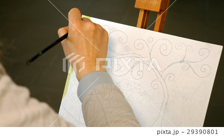 Female artist draws a pencil sketch in art studio Female artist draws a pencil sketch in art studio 29390801