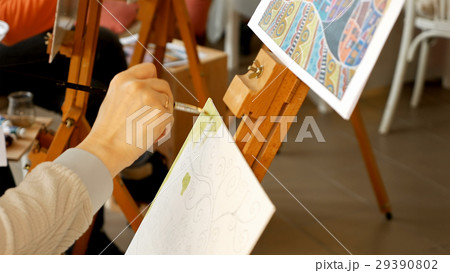 Female artist draws a pencil sketch in art studio Female artist draws a pencil sketch in art studio 29390802