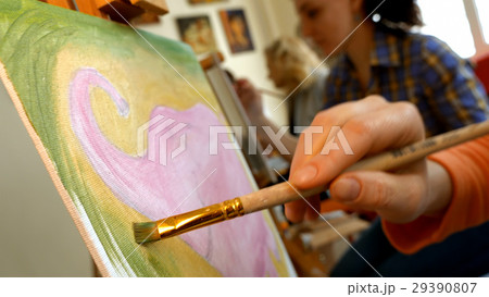 Female artist draws a pencil sketch in art studio 29390807