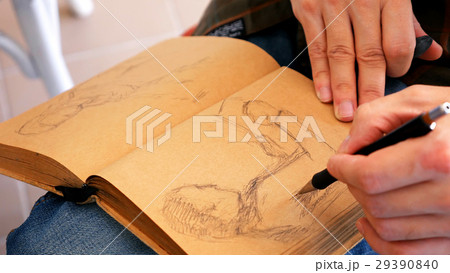 Graphic artist draws sketch picture artwork manual 29390840