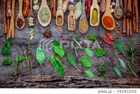 Various of spices and herbs in wooden spoons. 29391050