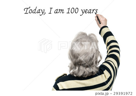 Old woman writes on wall with marker 29391972