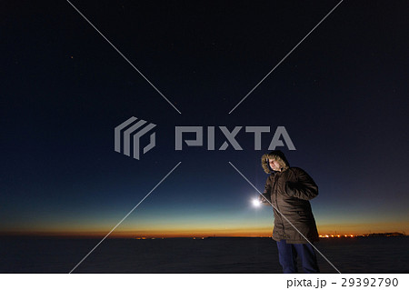 Silhouette of a man with a flashlight, observing Silhouette of a man with a flashlight, observing 29392790
