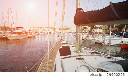 Yacht sailing toward from small yacht harbor 29400296