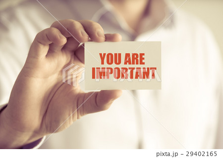 Businessman holding YOU ARE IMPORTANT message card 29402165