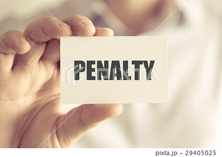 Businessman holding PENALTY message card 29405025