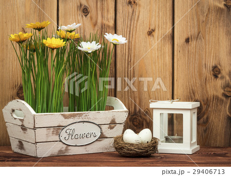 Wooden box with flowers on the wooden background. Wooden box with flowers on the wooden background. 29406713