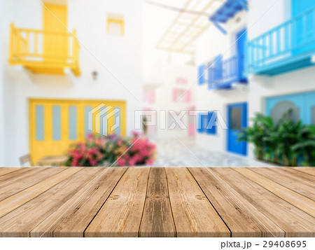 Wooden board empty table blurred hotel building. 29408695